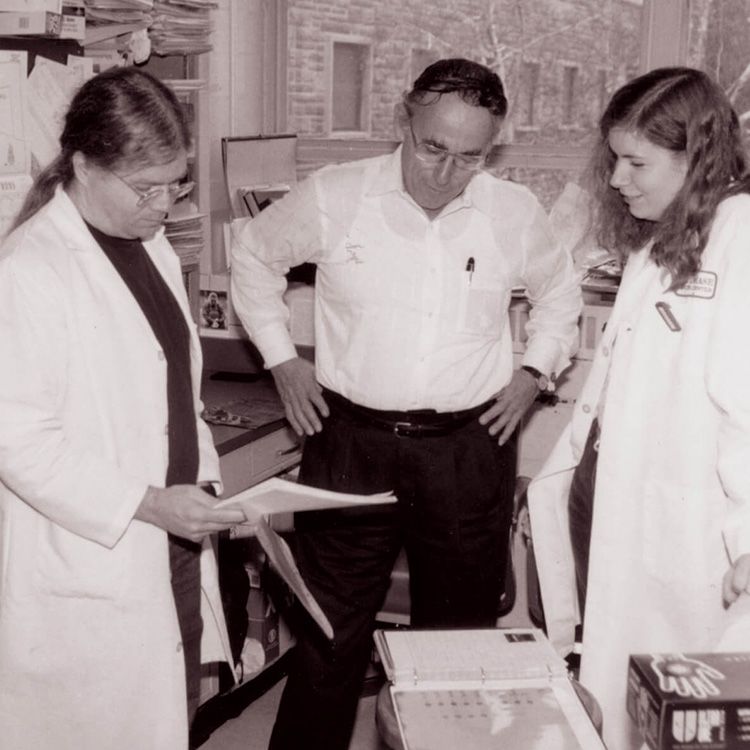 Black and white photo of Robert B. Perry, PhD and two Fox Chase Cancer Center professionals.