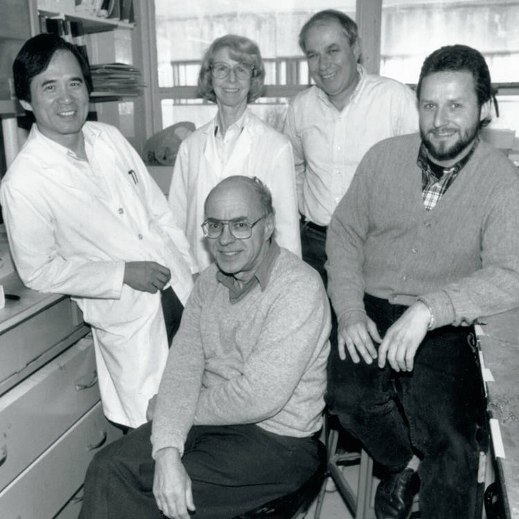 Black and white photo of Irwin A. “Ernie” Rose, PhD (front center), and Avram Hershko, MD, PhD (back row, third from left).