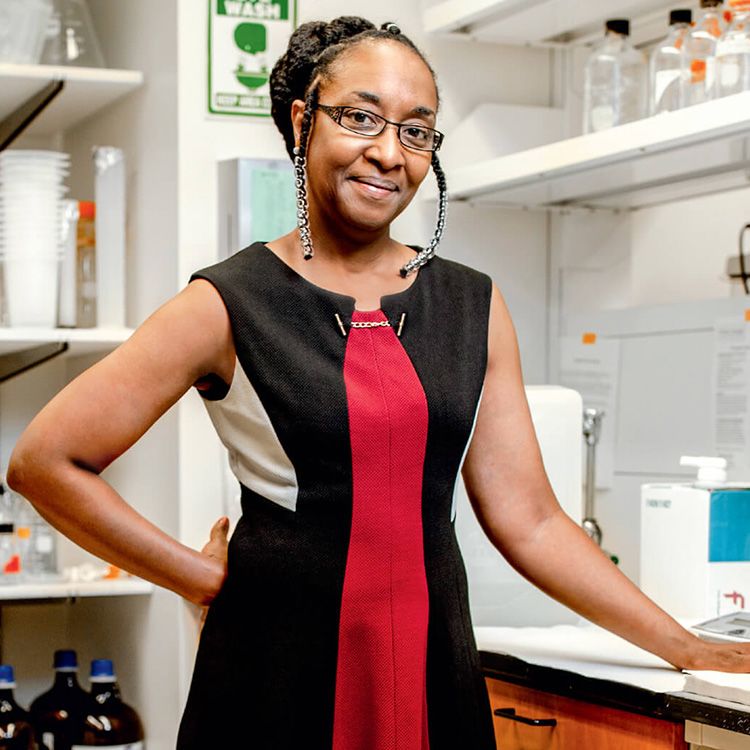Image of Camille Ragin, PhD, MPH smiling for a photo in a laboratory.
